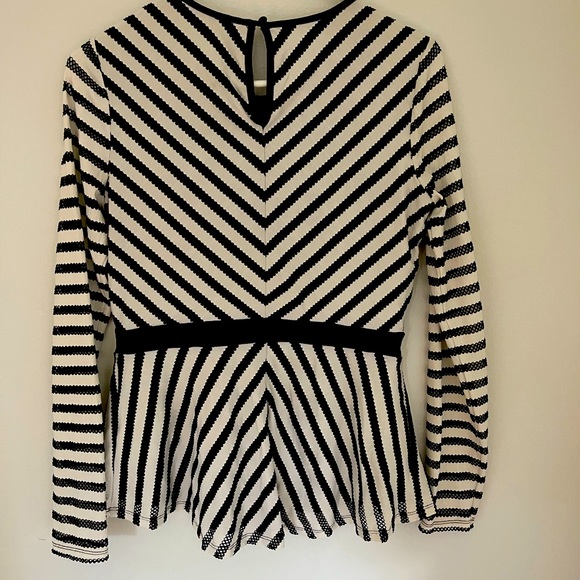 Black and white netted peplum top. Body of top is lined. - Picture 2 of 3